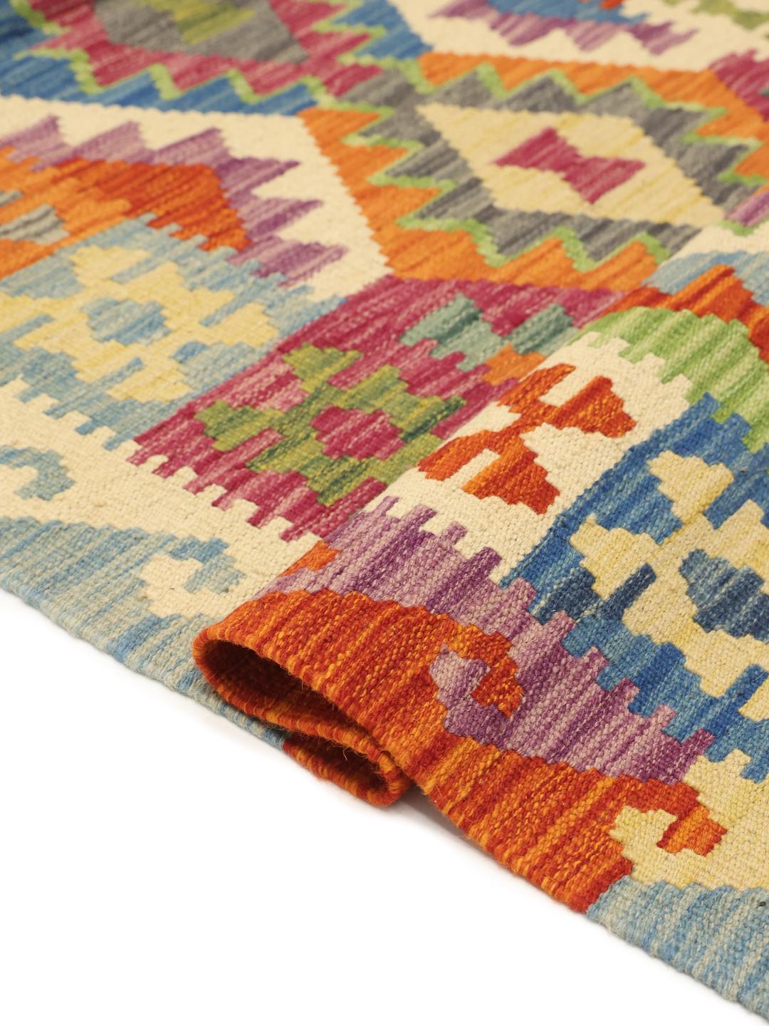 Hand-woven Afghan runner with colourful geometric patterns