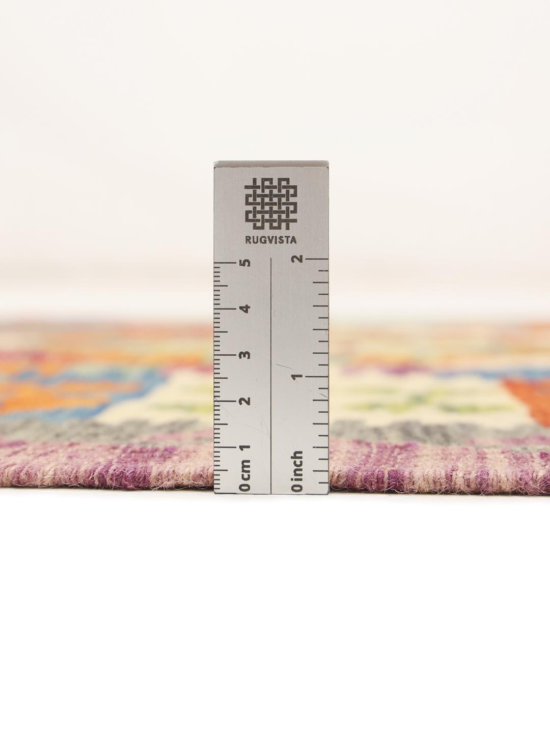 Hand-woven Afghan runner with colourful geometric patterns