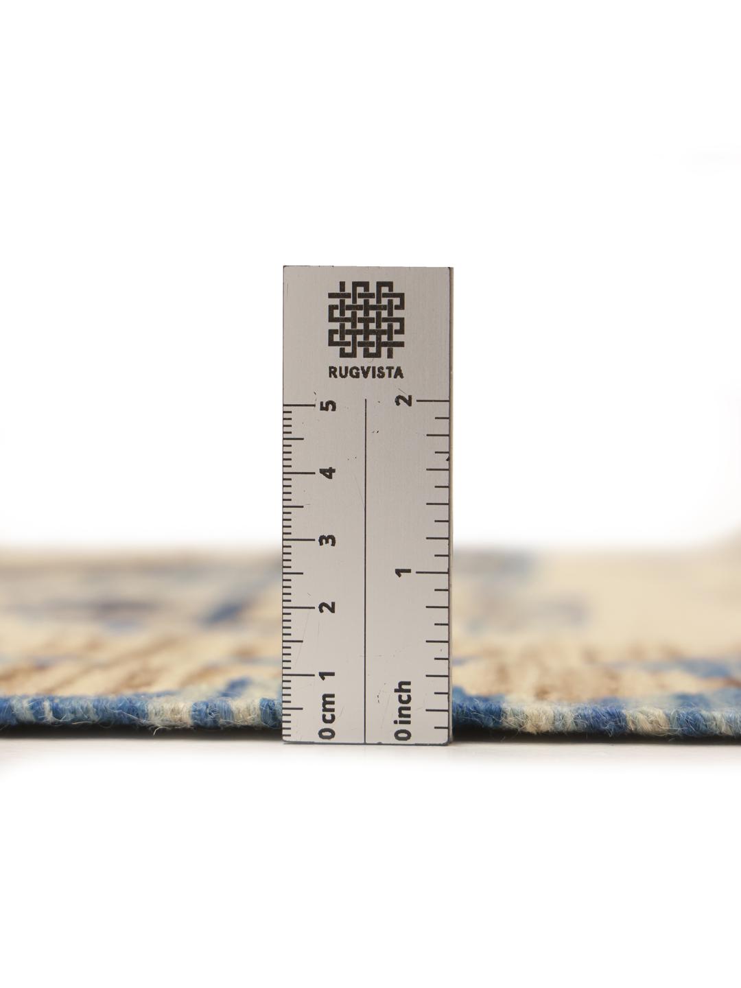 Hand-woven Afghan runner featuring blue and beige geometric patterns