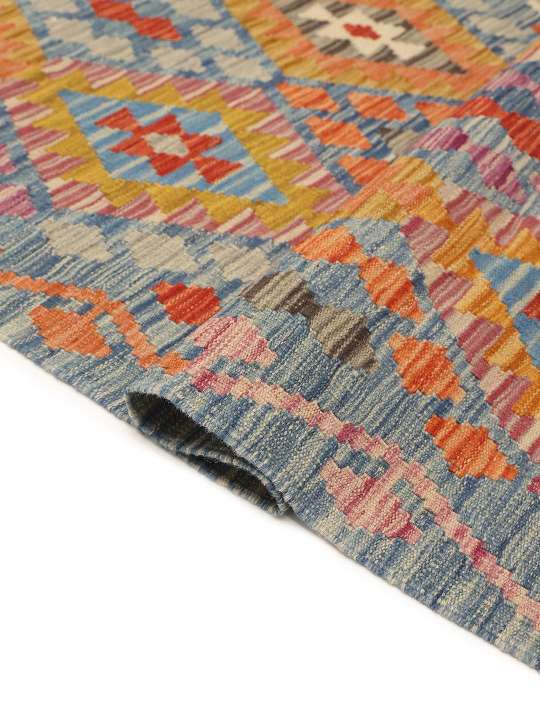 Hand-woven Afghan runner with vibrant geometric diamond patterns in a multicolor palette
