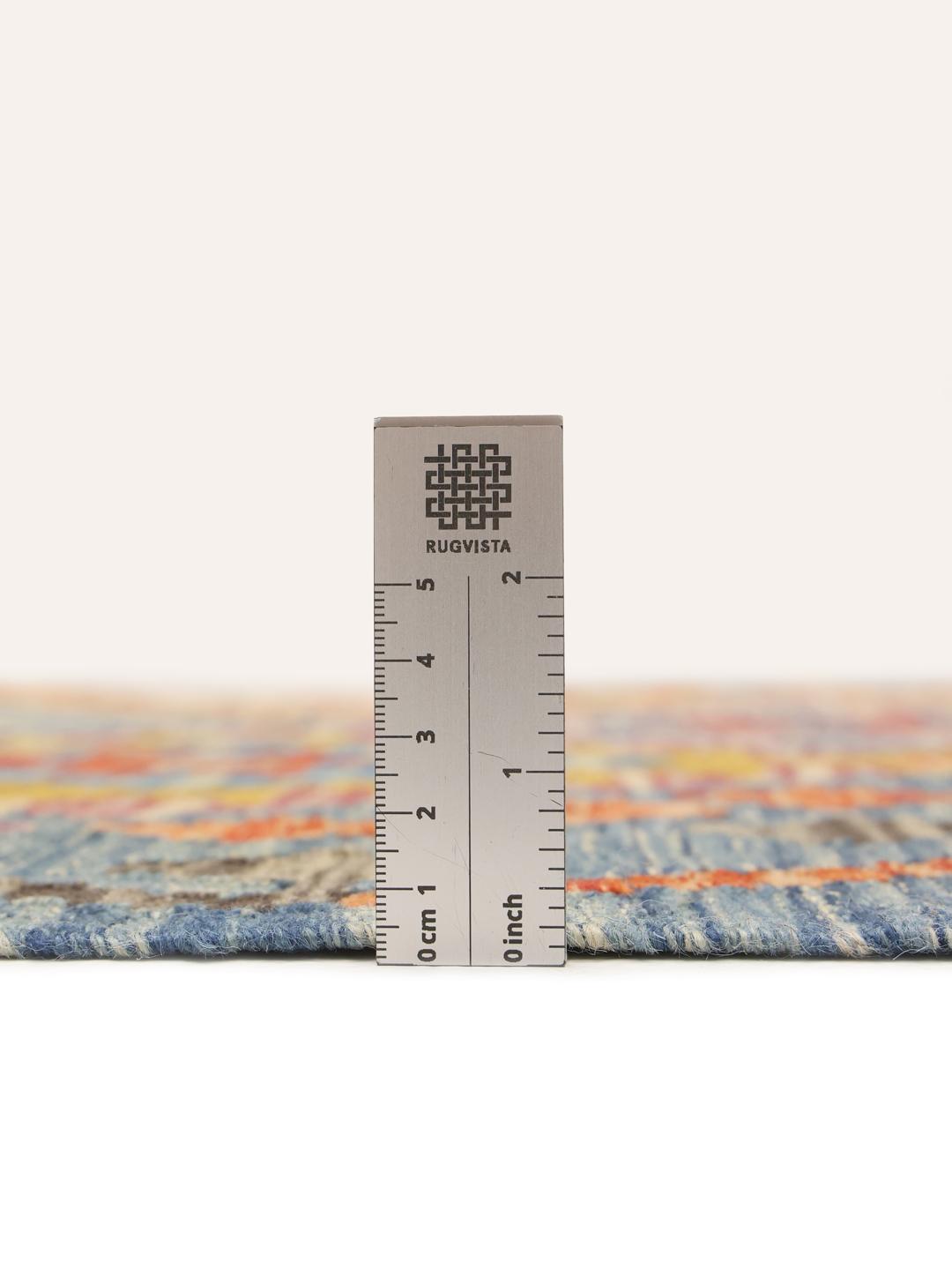 Hand-woven Afghan runner with vibrant geometric diamond patterns in a multicolor palette