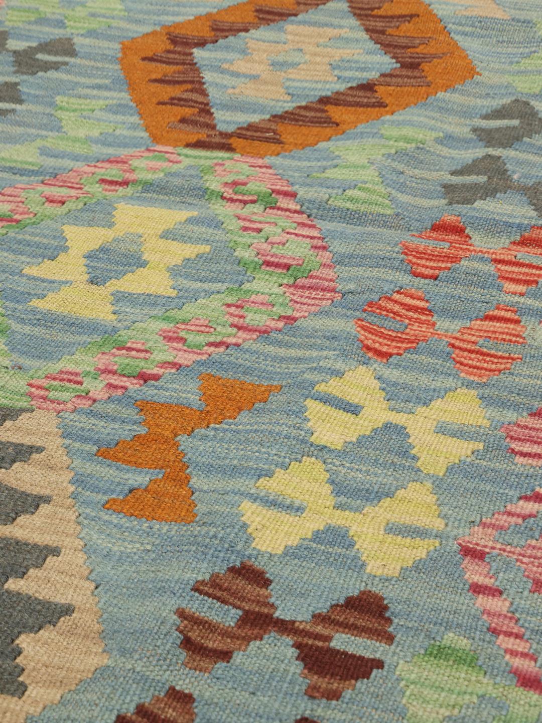 Hand-woven blue Afghan runner with geometric patterns