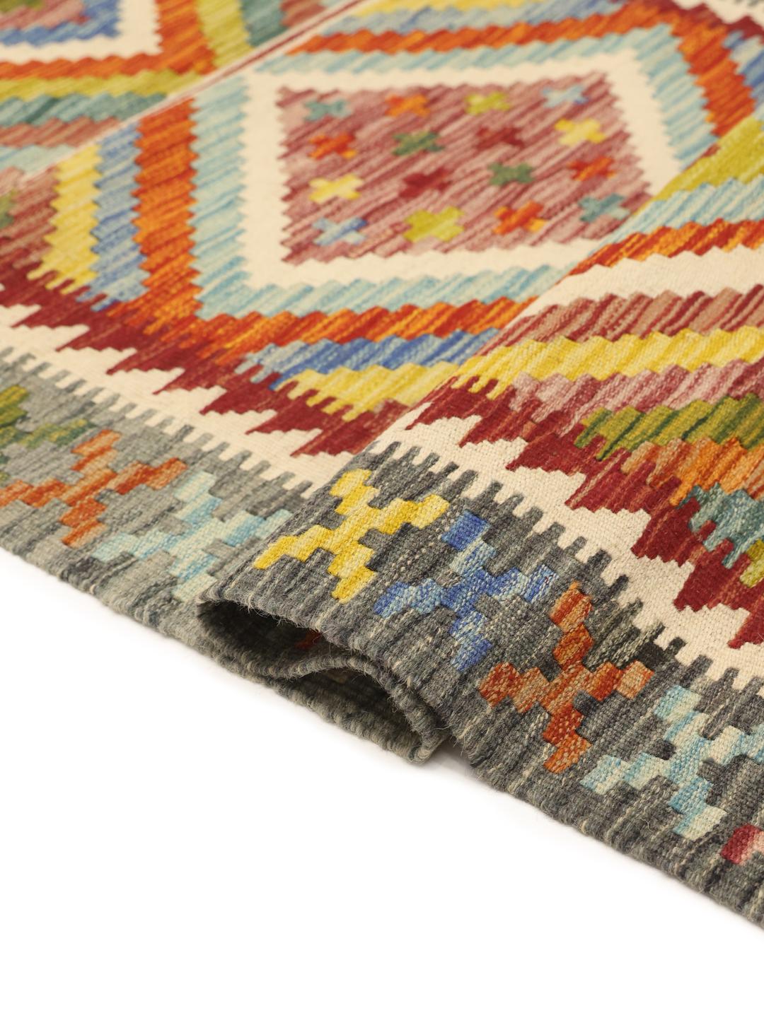 Hand-woven Afghan runner featuring a vibrant, multicolor geometric diamond pattern.