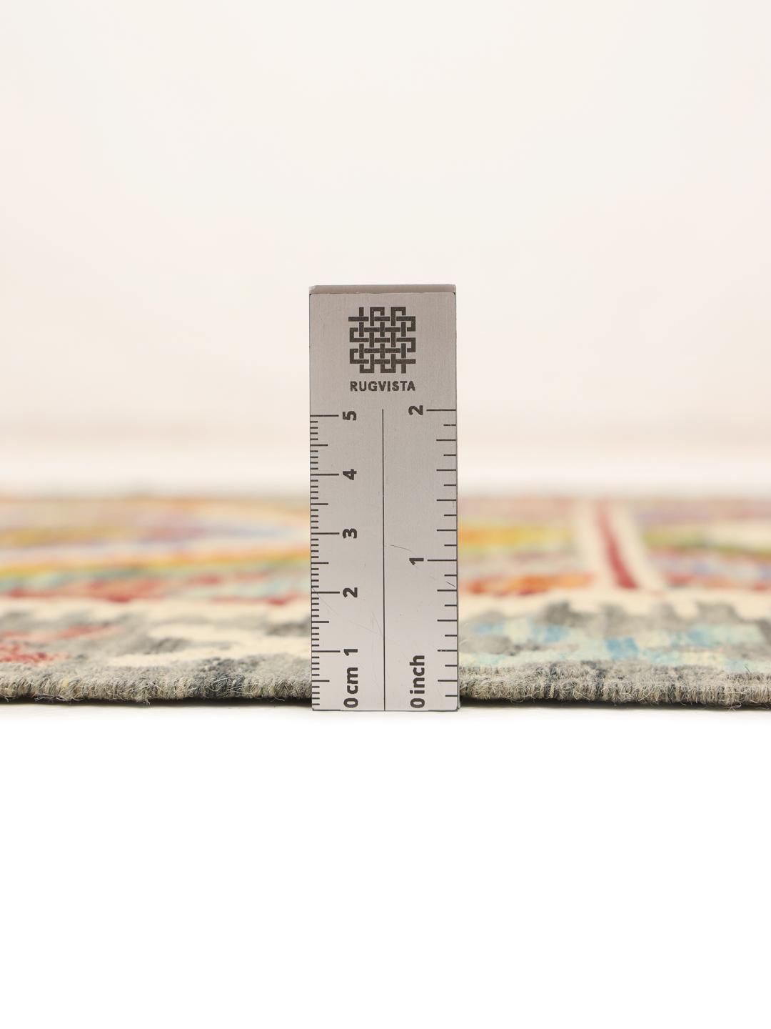 Hand-woven Afghan runner featuring a vibrant, multicolor geometric diamond pattern.