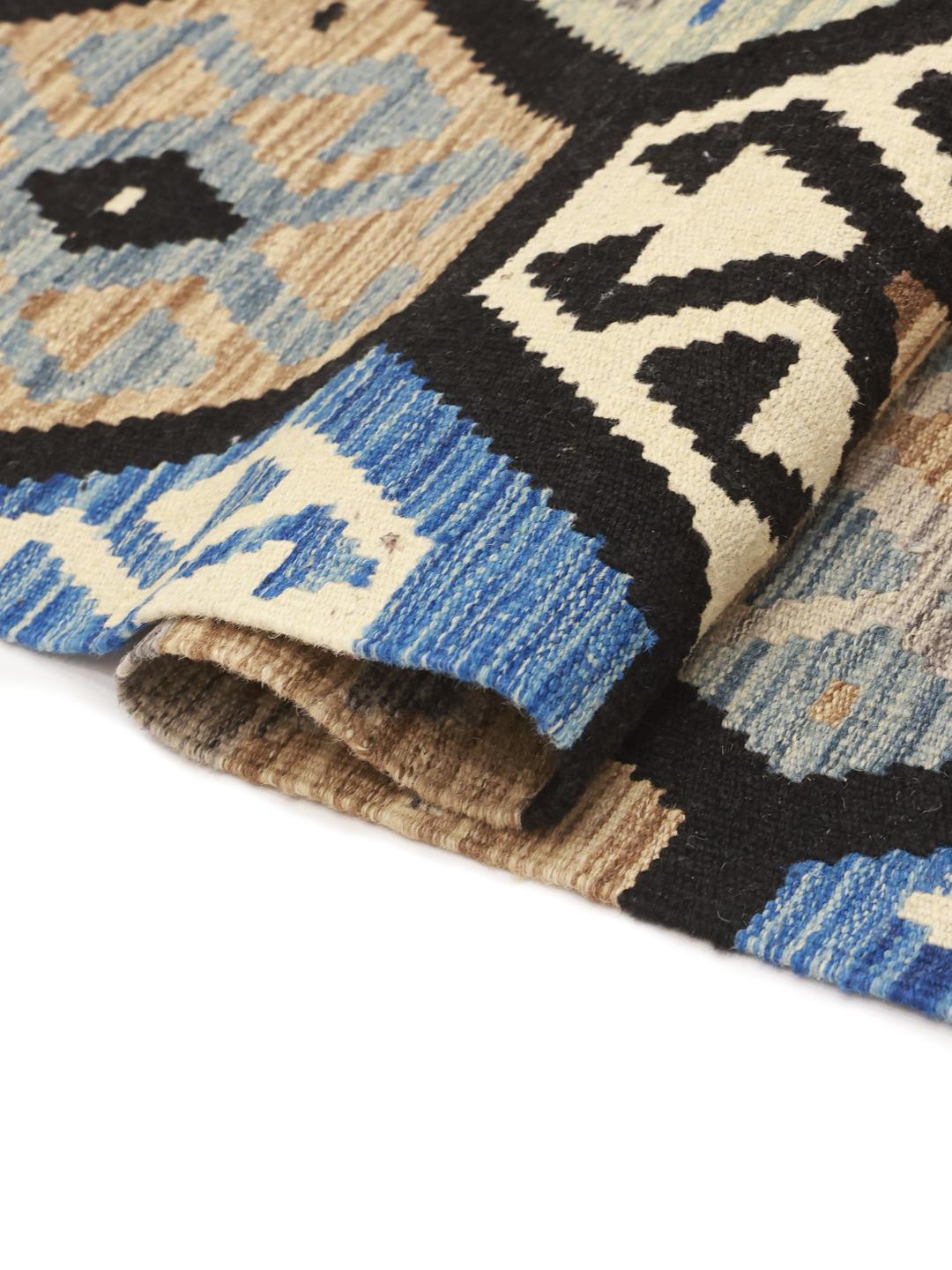 Hand-woven Afghan Kelim rug featuring blue and beige geometric patterns