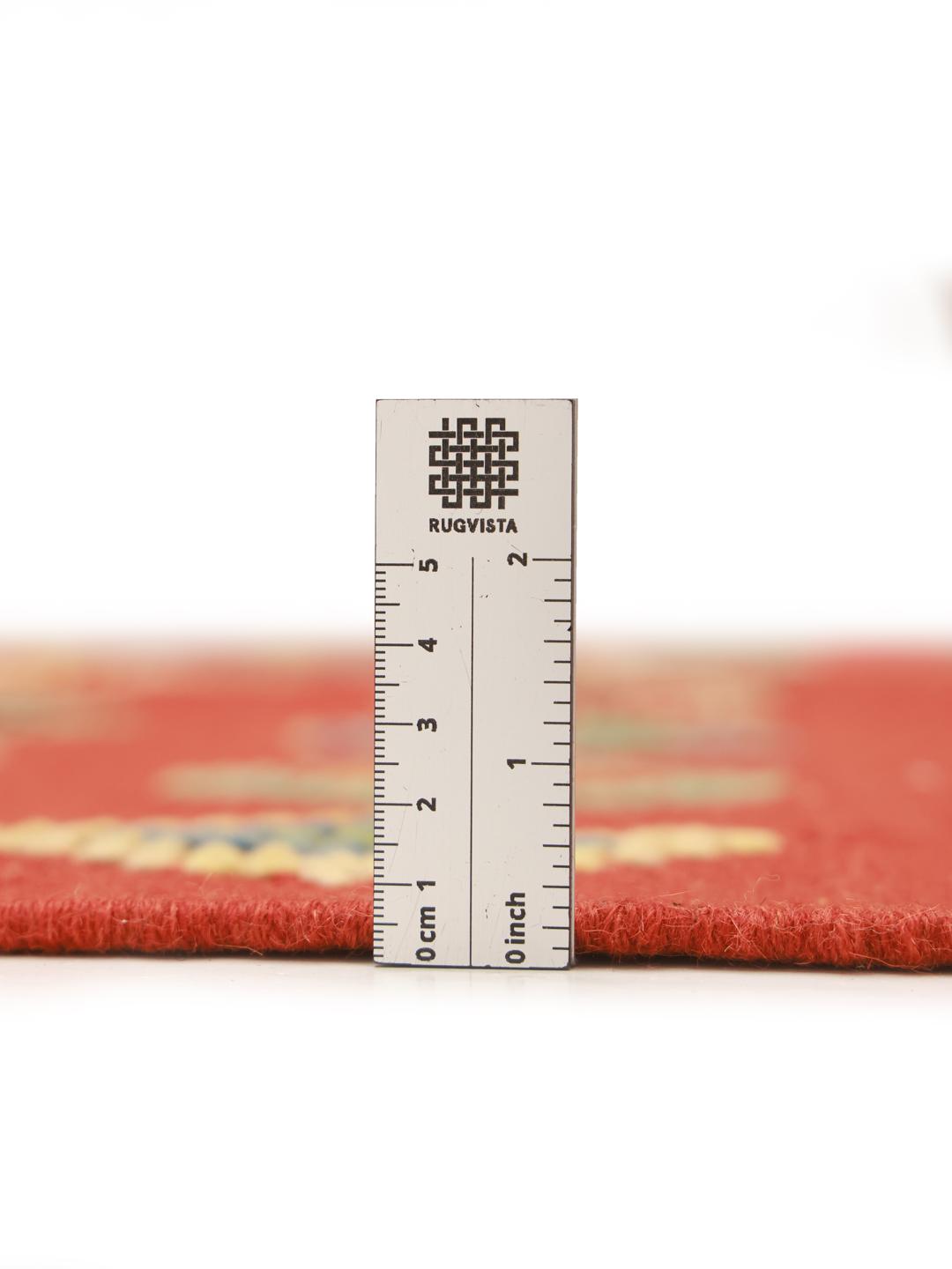 Hand-woven Afghan Kelim Nimbaft rug with a red field and multi-coloured geometric diamonds