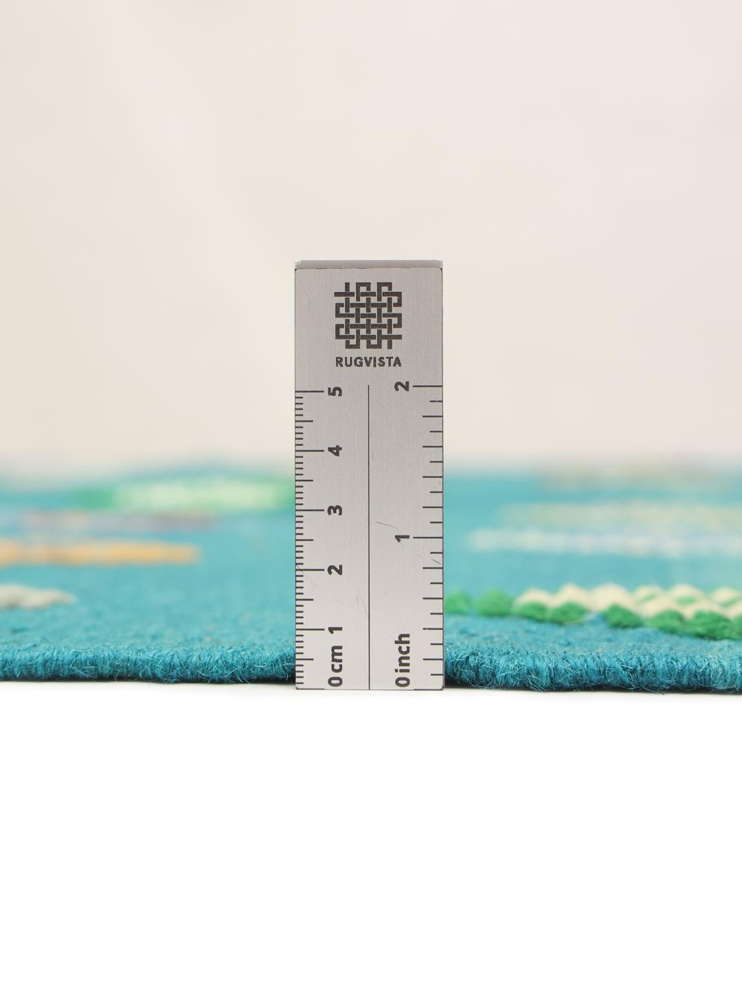 Handgeweven Afghaans Kilim tapijt met een blauwgroen veld en veelkleurig ruitpatroon