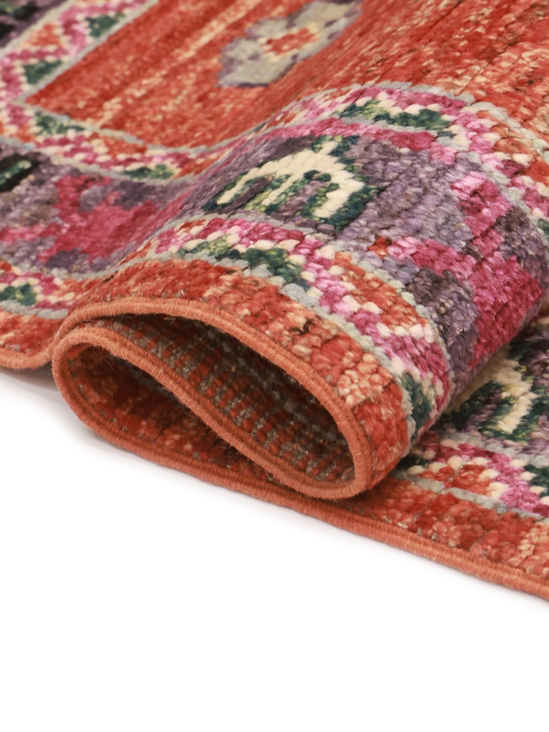 Hand-knotted Kazak rug from Afghanistan in vibrant red and blue tones
