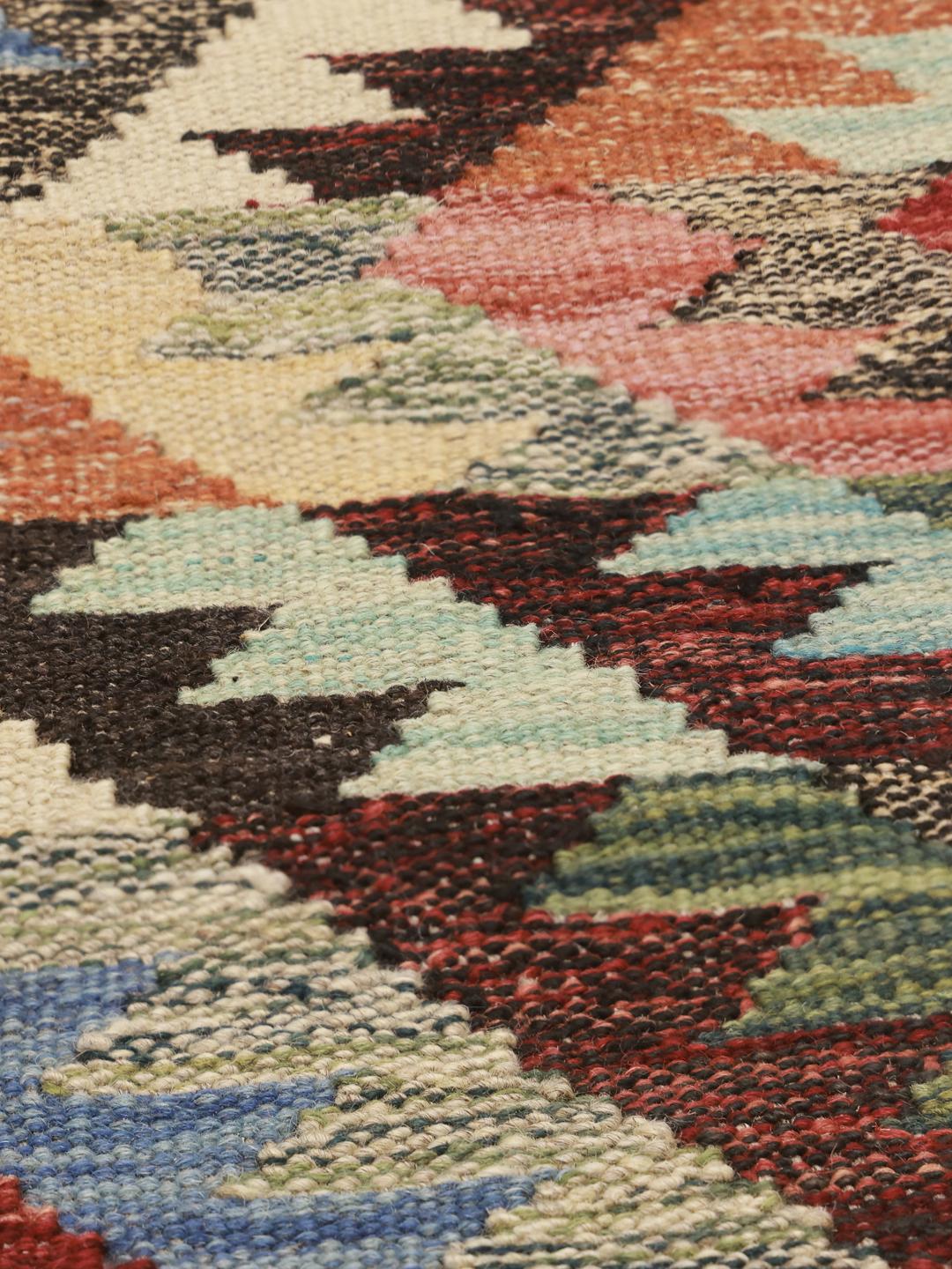 Hand-woven Afghan runner rug with a multicolor geometric pattern