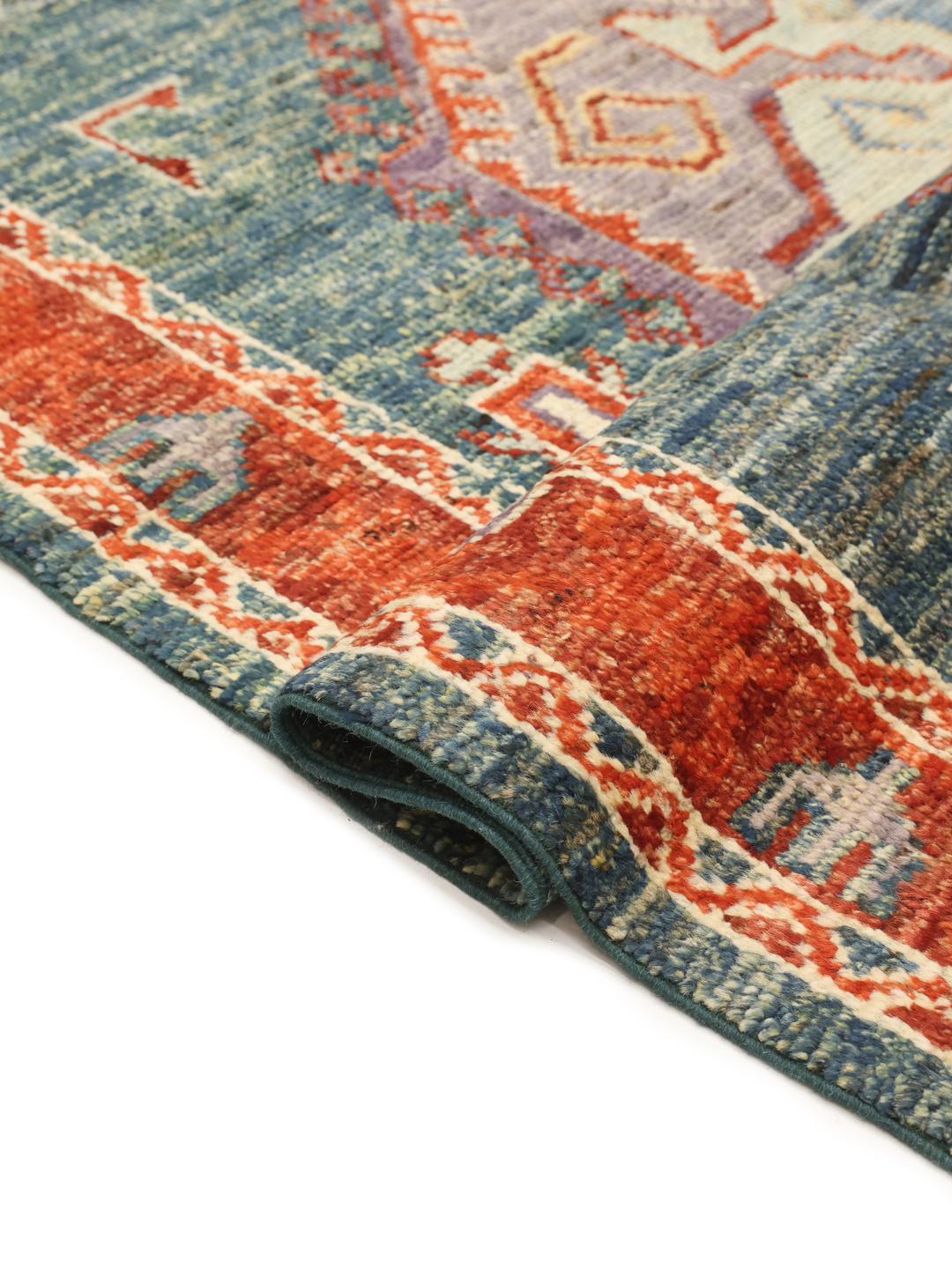 Hand-knotted Kazak rug from Afghanistan with a blue and red geometric pattern.