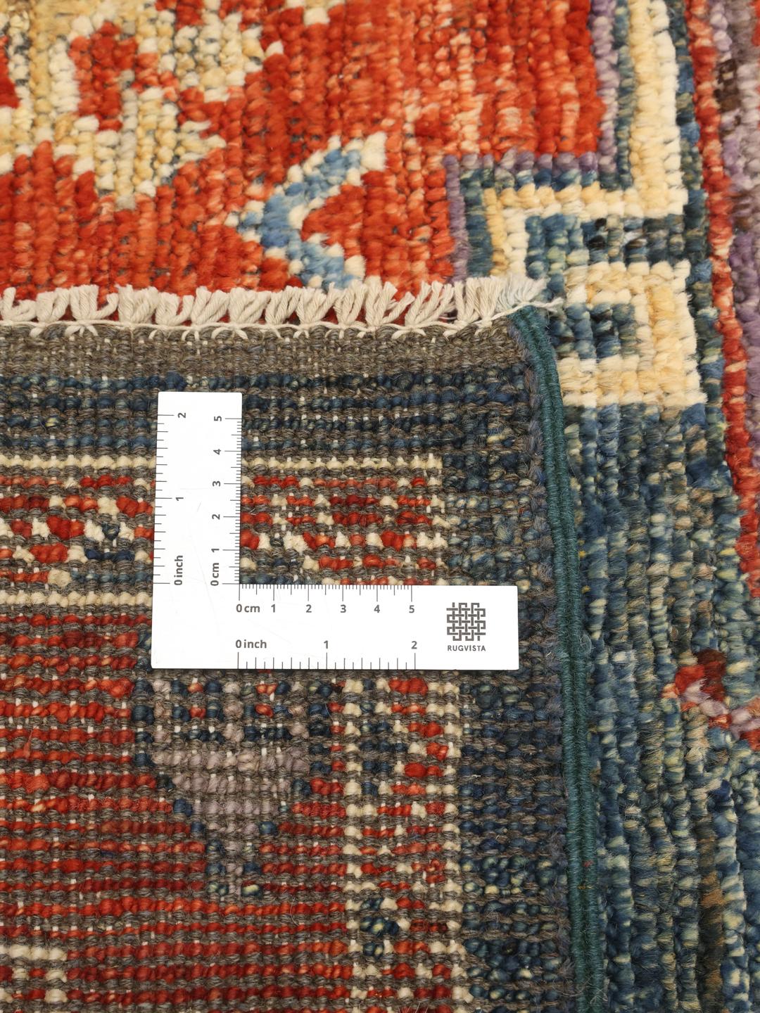 Hand-knotted Kazak rug from Afghanistan with a blue and red geometric pattern.