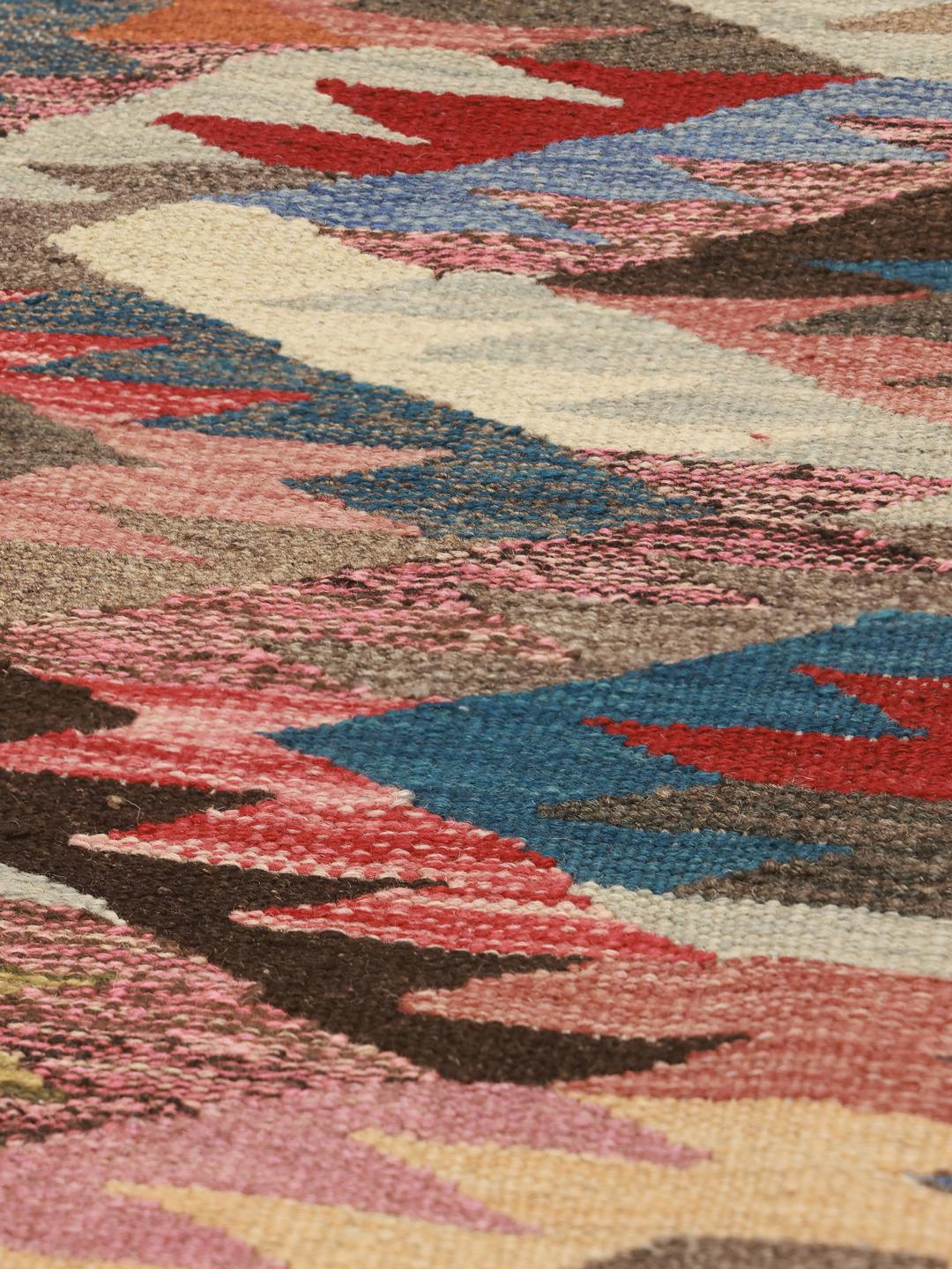 Hand-woven runner with a vibrant multicolored geometric pattern