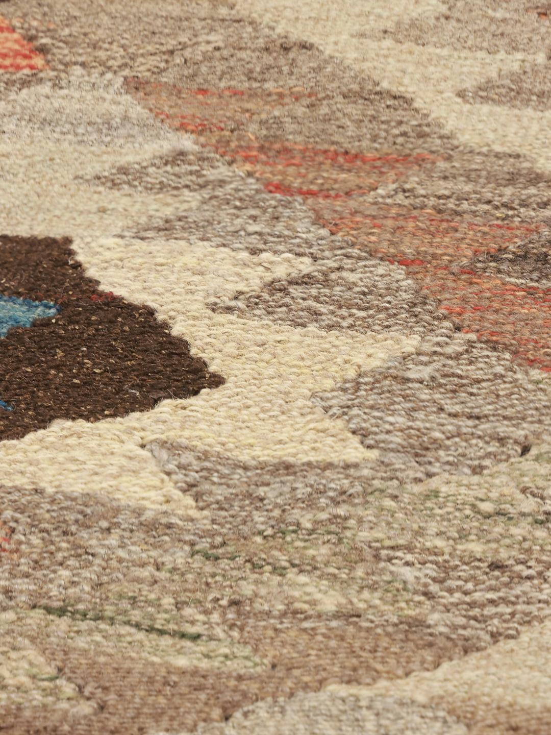 Hand-woven Afghan runner with geometric patterns in beige and earthy tones