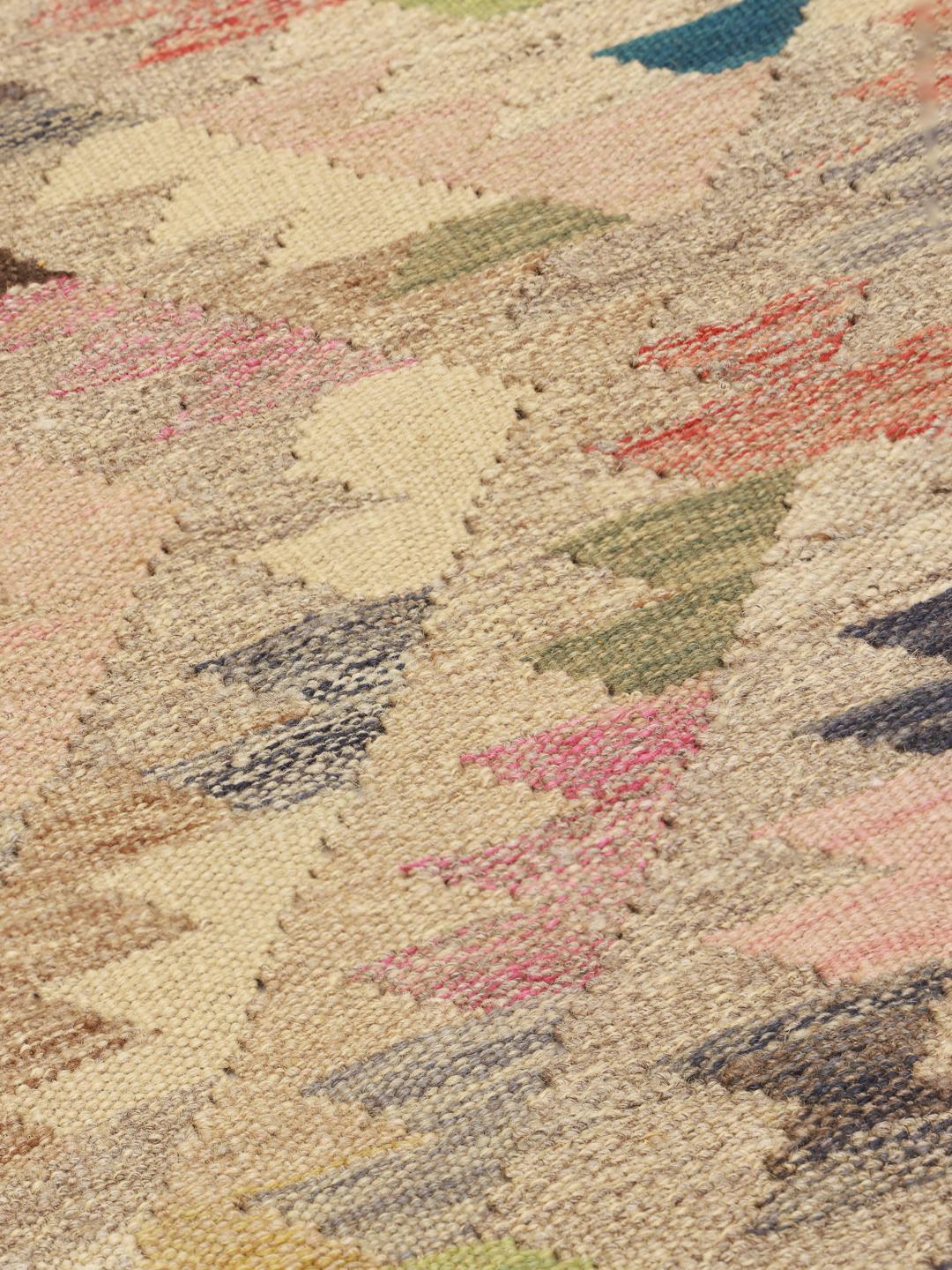 Hand-woven Afghan runner with a geometric diamond pattern in multicolour wool