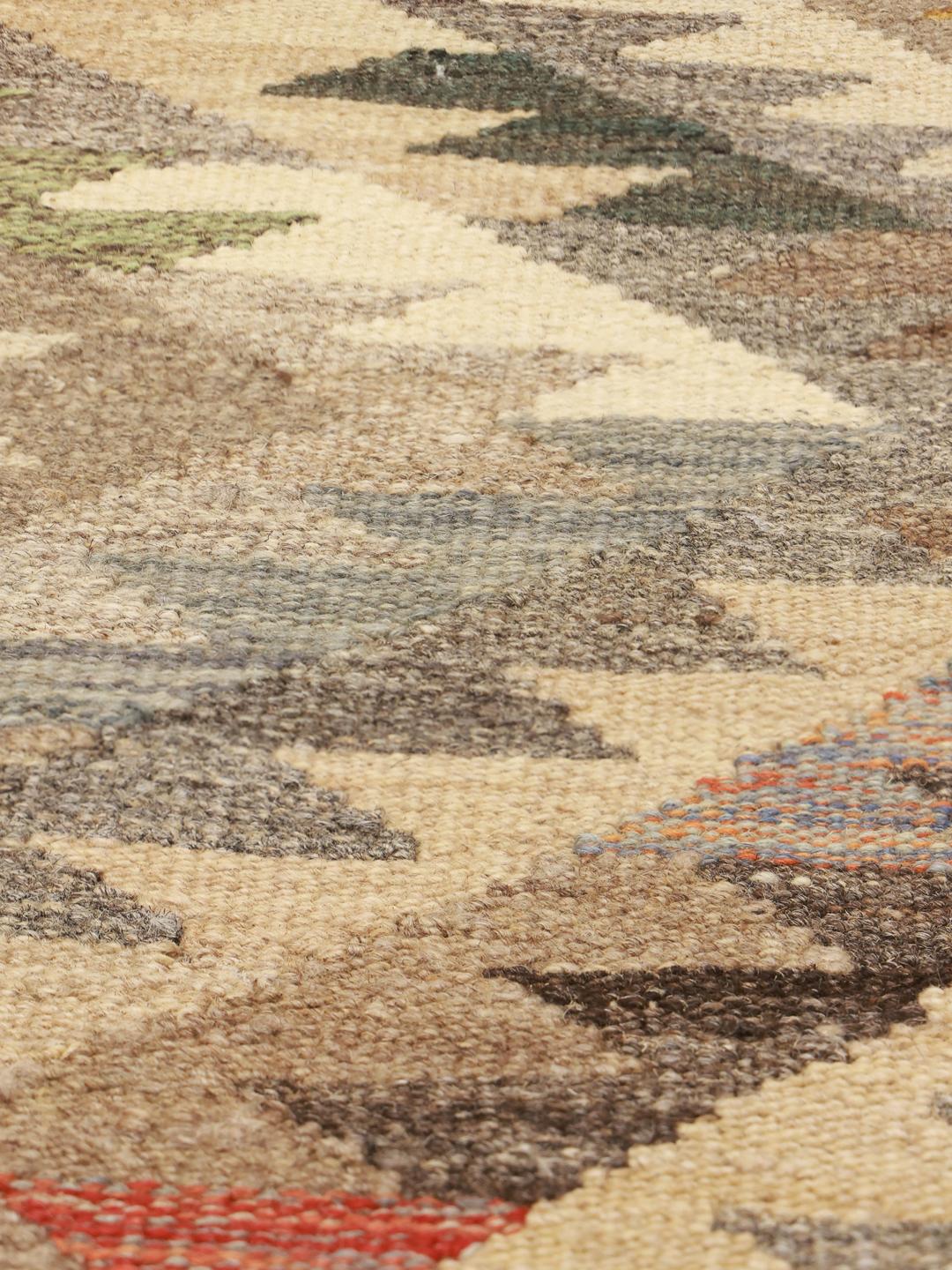 Hand-woven Afghan Kilim runner in earthy tones with geometric diamond patterns