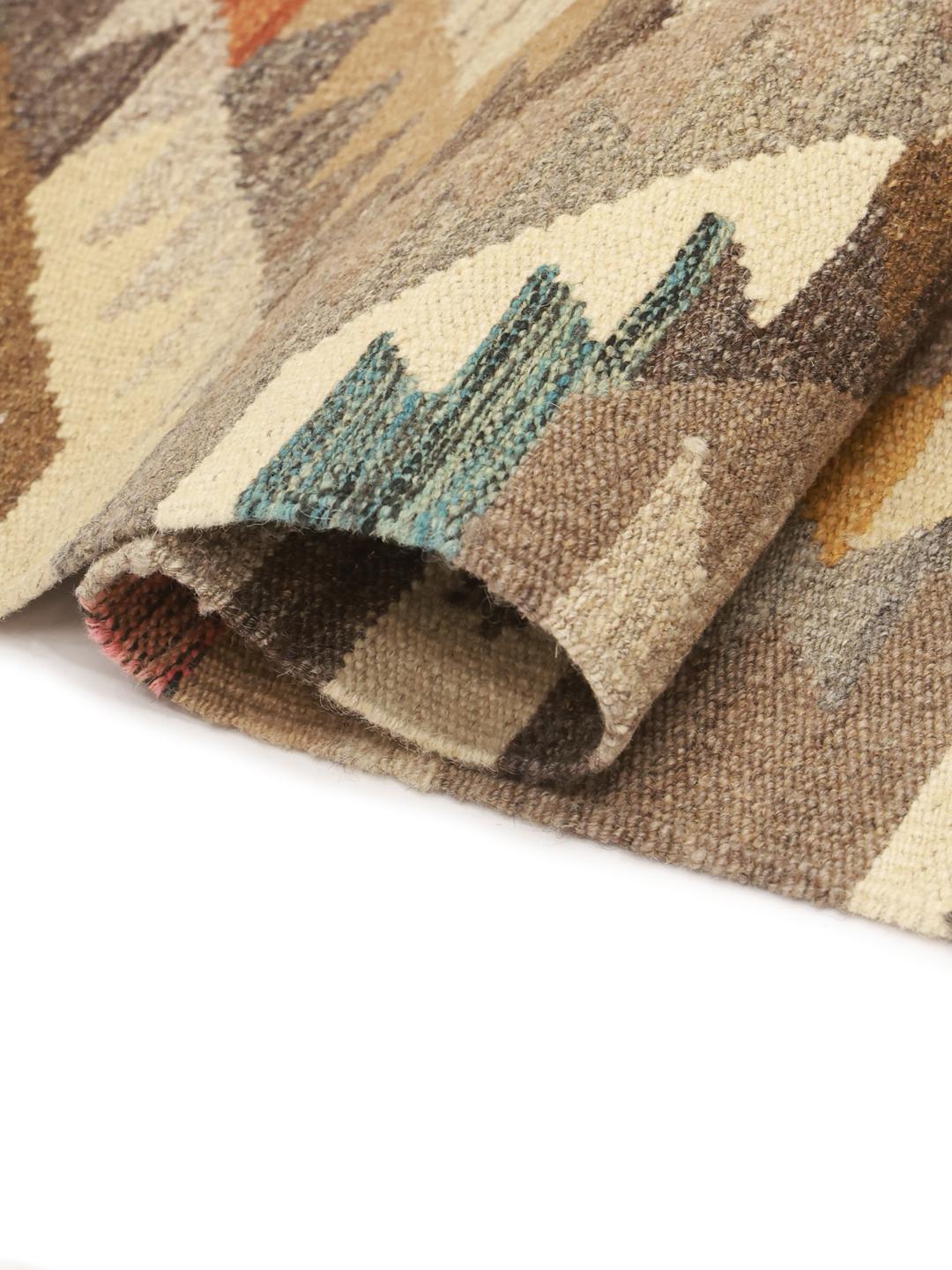 Hand-woven Afghan Kilim runner in earthy tones with geometric diamond patterns