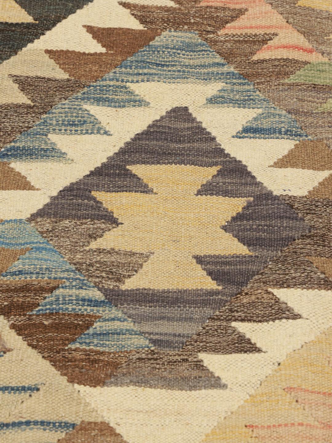 Hand-woven Afghan Kilim Ariana runner with geometric diamond patterns in multicolor wool.