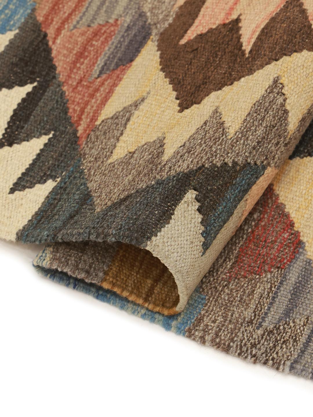 Hand-woven Afghan Kilim Ariana runner with geometric diamond patterns in multicolor wool.