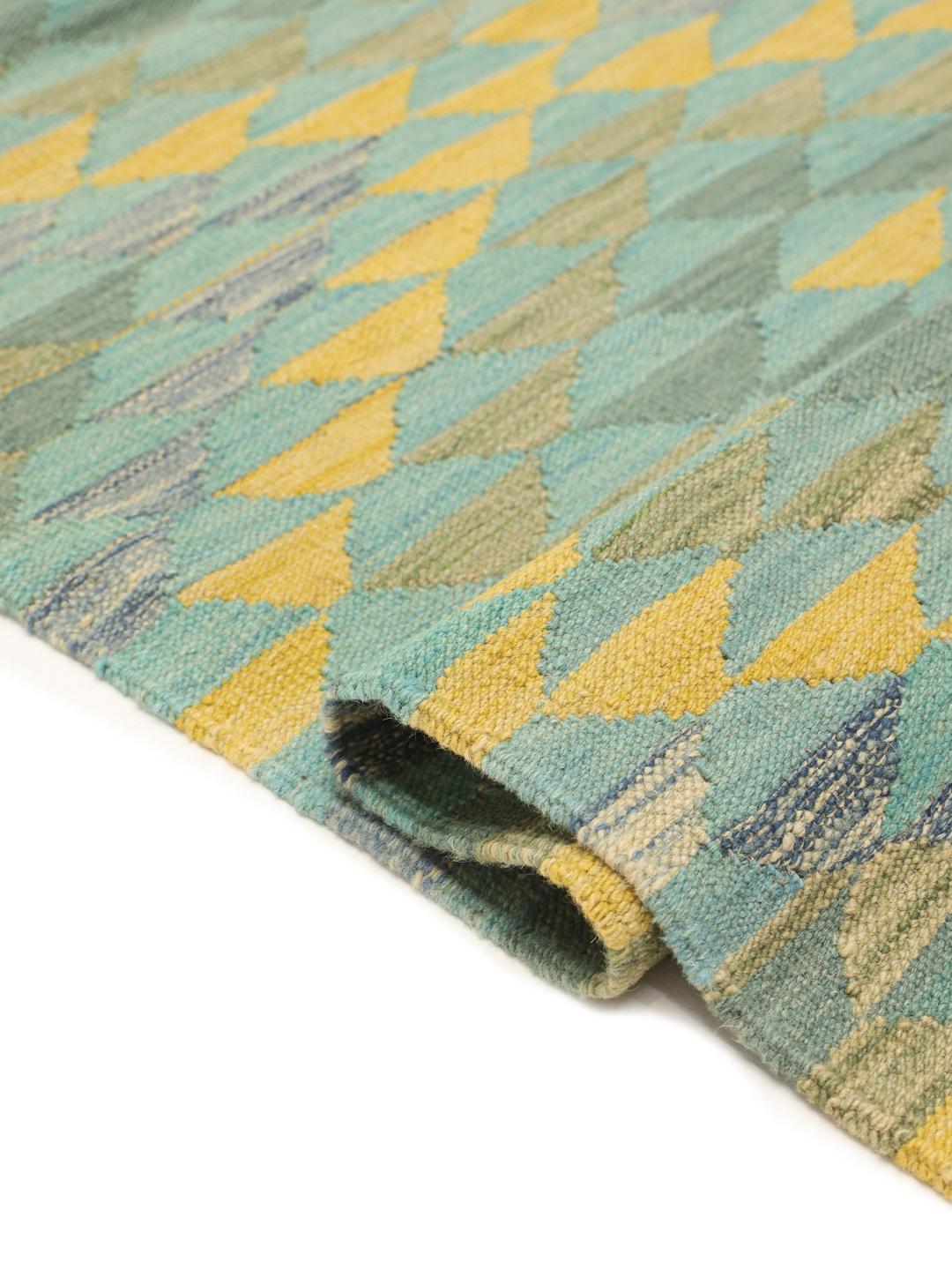 Handmade runner rug from Afghanistan with teal and yellow geometric patterns
