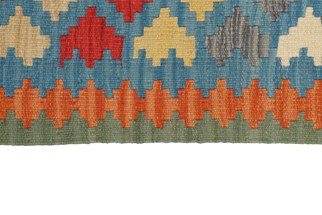 Handgeweven Kilim Qashqai tapijt met levendige geometrische patronen in veelkleurige wol.
