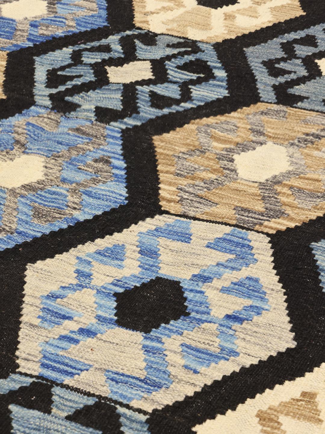 Handmade Afghan Kelim rug with blue and beige geometric patterns
