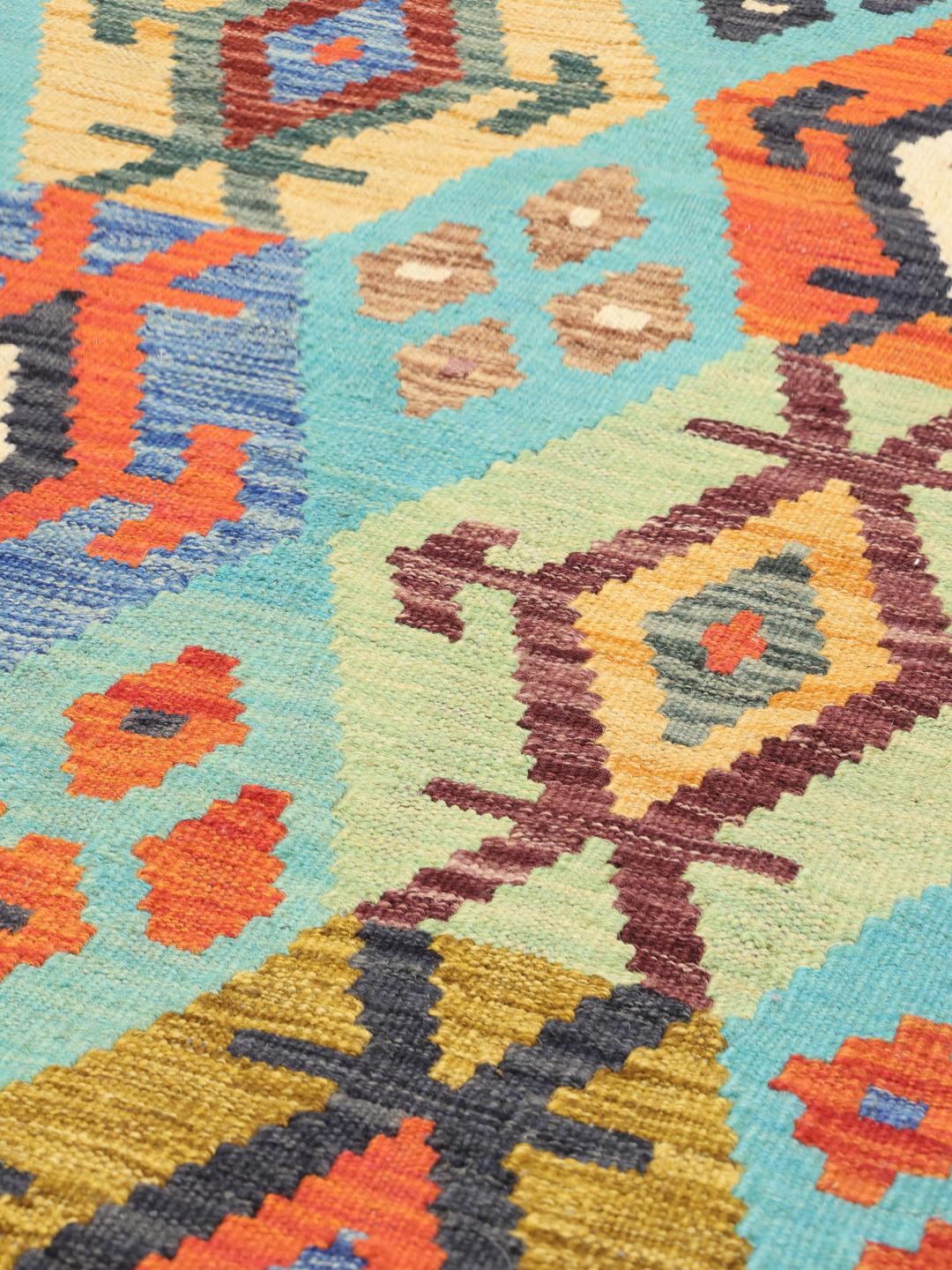 Hand-woven Afghan runner rug with geometric diamond motifs in multicolor and light-blue