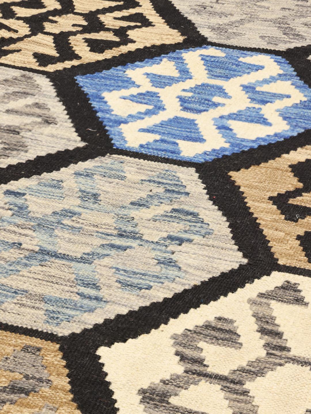 Hand-woven Afghan Kelim rug in blue and earthy tones
