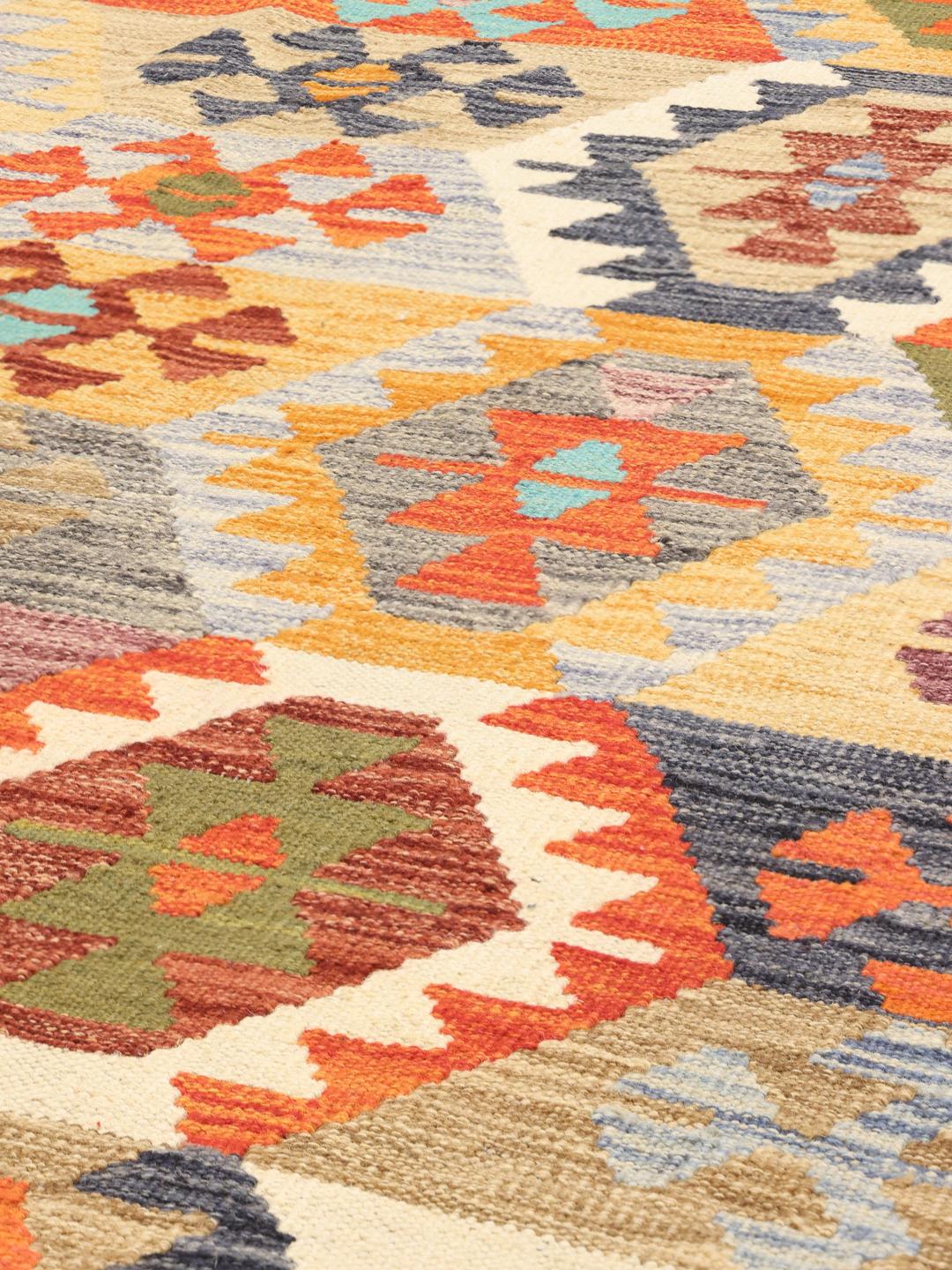 Handmade Afghan Kelim rug with vibrant multicolour geometric patterns