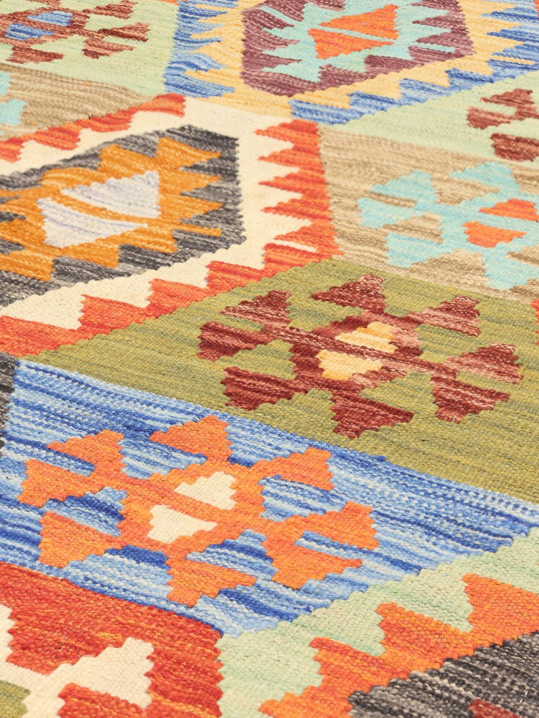 Handmade Afghan Kelim rug with multicolored geometric patterns