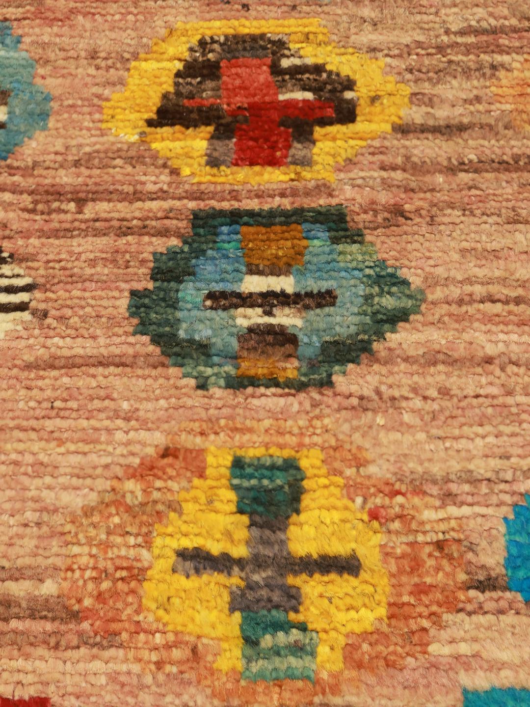 Hand-knotted Afghan rug with colourful geometric patterns on a beige background