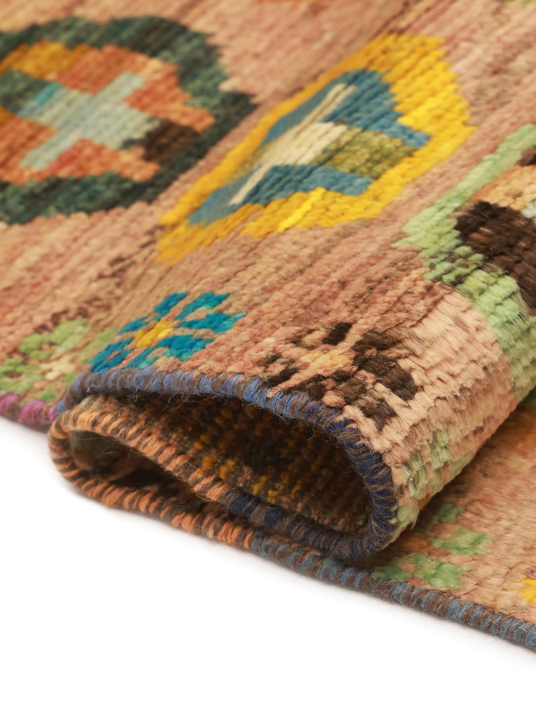 Hand-knotted Afghan rug with colourful geometric patterns on a beige background