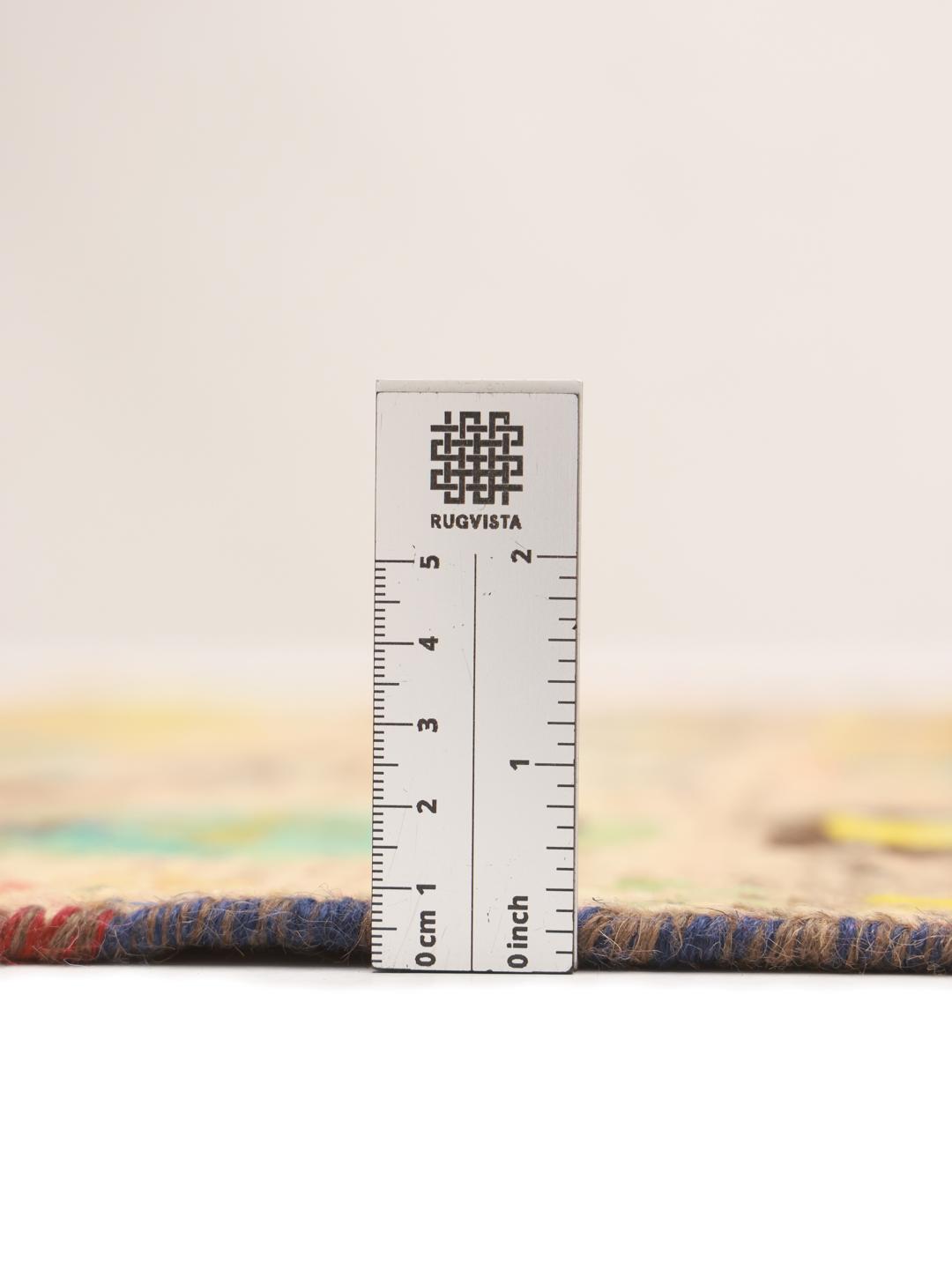 Hand-knotted Afghan rug with colourful geometric patterns on a beige background