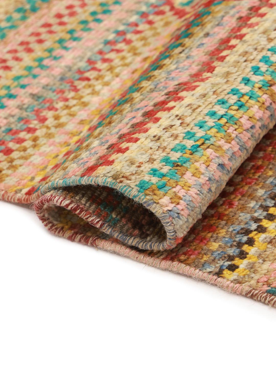 Hand-knotted multicoloured Berber rug from Afghanistan with a bold geometric medallion design.