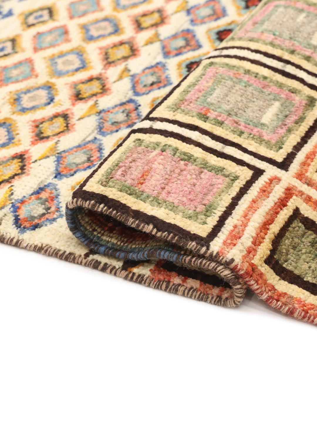 Handmade Afghan rug with beige background and colourful geometric patterns