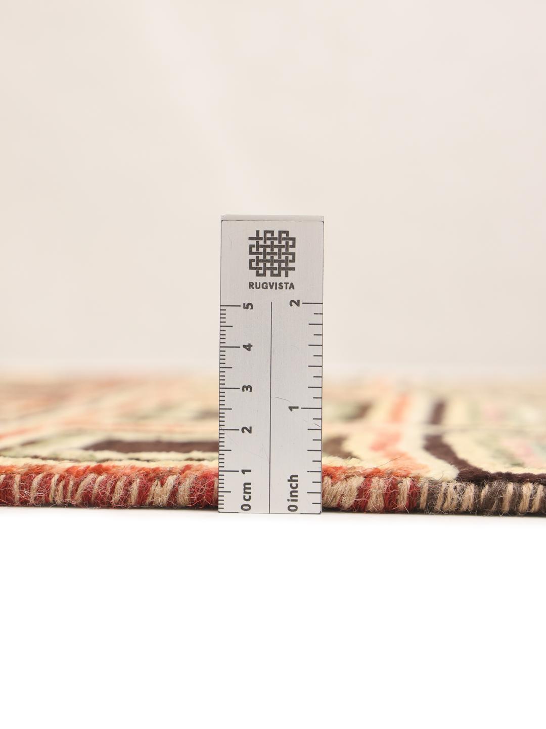 Handmade Afghan rug with beige background and colourful geometric patterns