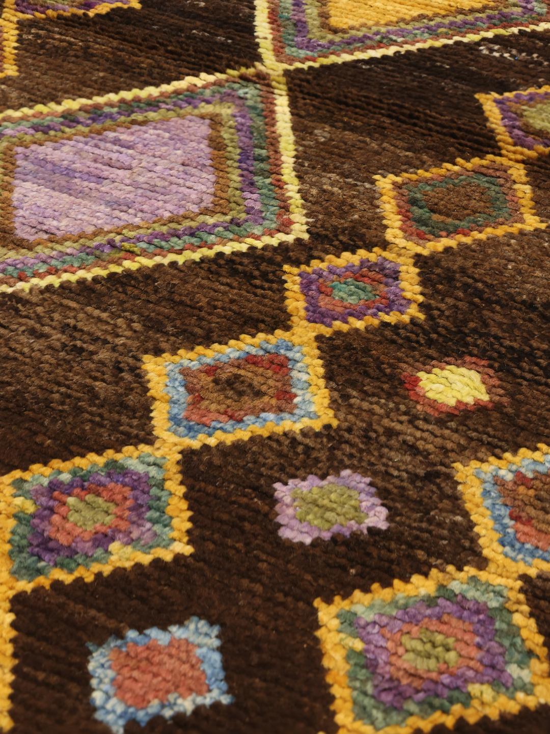 Handmade Afghan rug with colourful diamond motifs and brown background