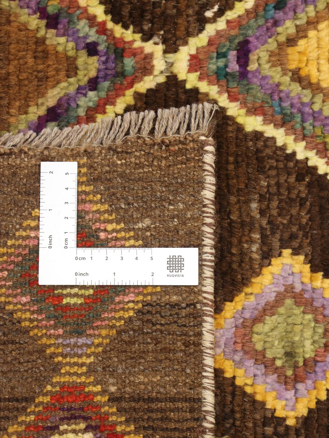 Handmade Afghan rug with colourful diamond motifs and brown background
