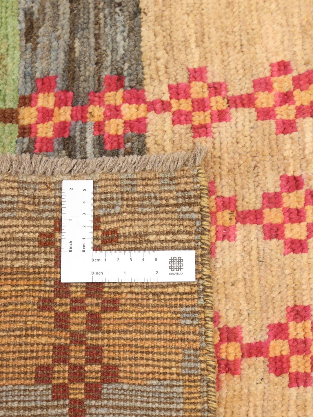 Handmade Afghan rug with multicolored stripes and geometric motifs