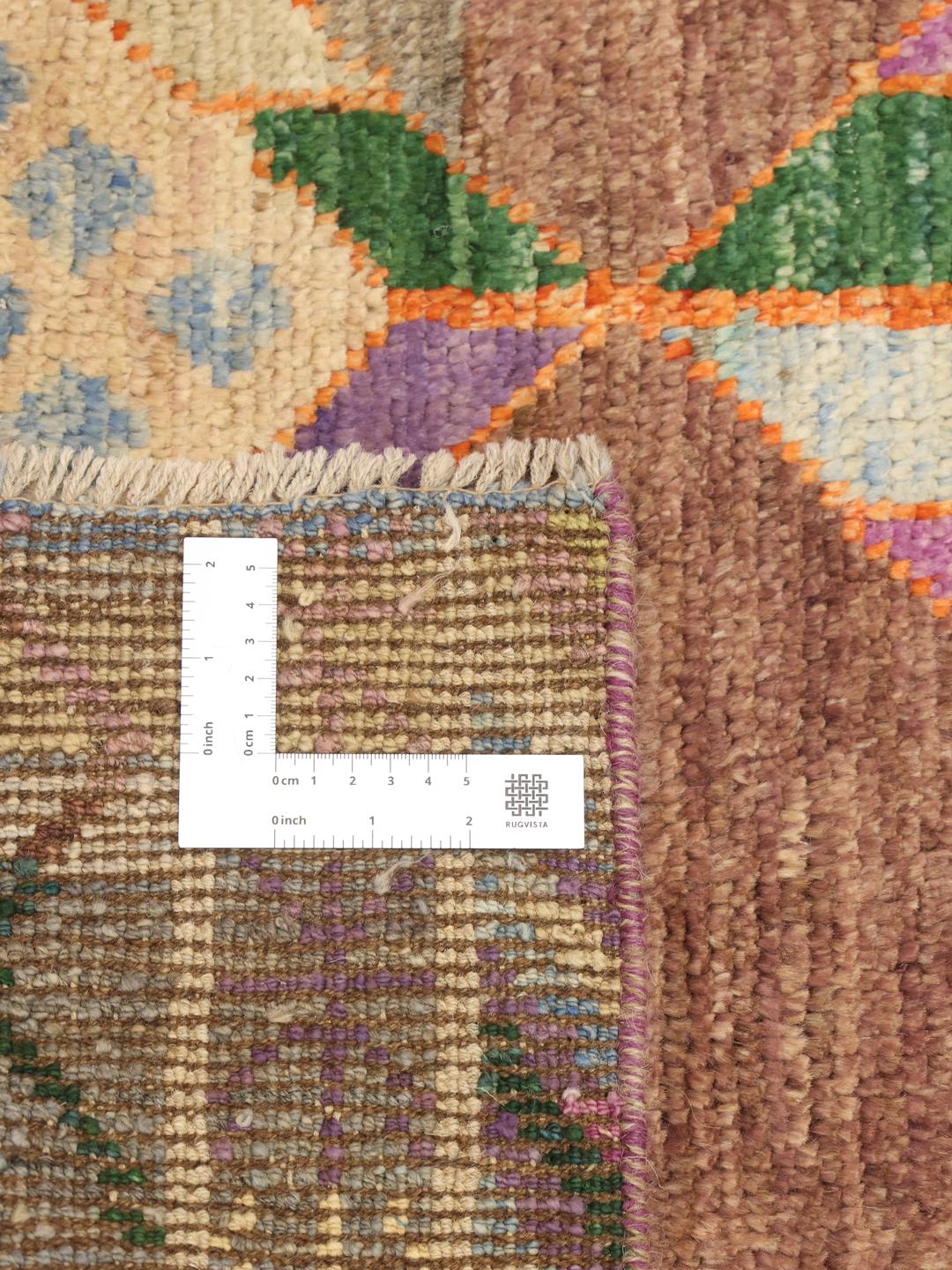 Handmade wool rug from Afghanistan in multicolour