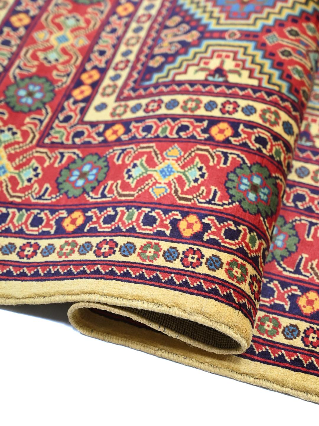 Hand-knotted Afghan Kunduz rug with red and blue geometric patterns