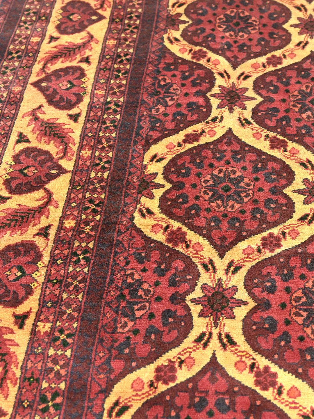 Kunduz rug from Afghanistan in dark-red and beige