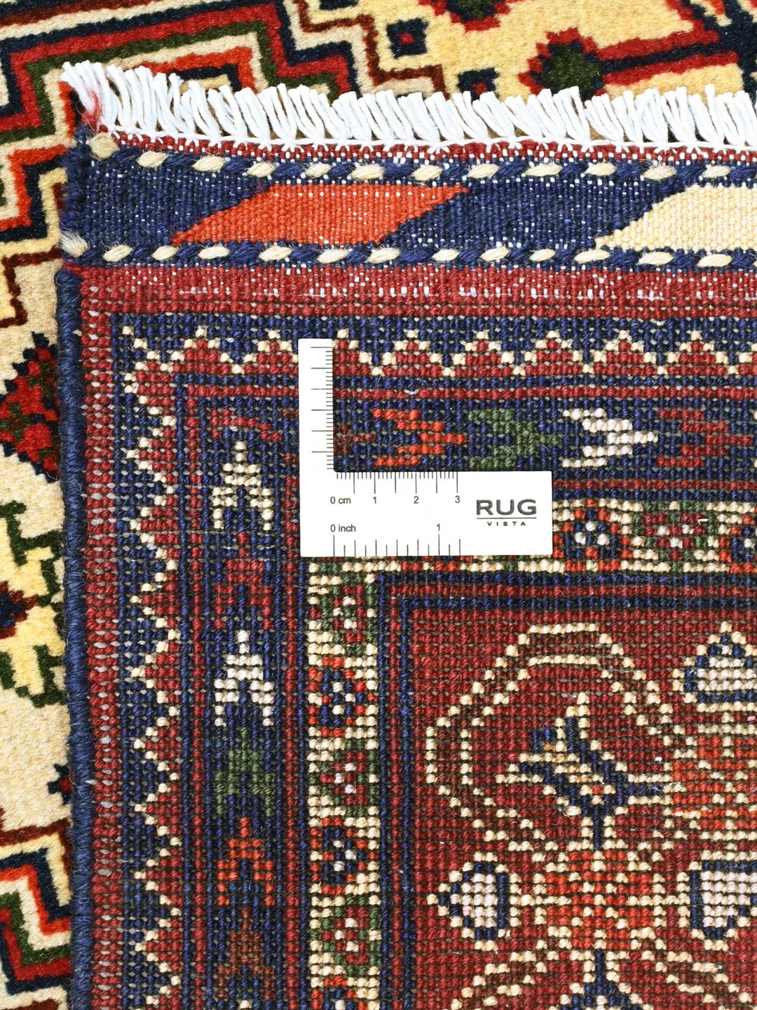 Hand-knotted Afghan Kunduz rug in deep red and blue tones