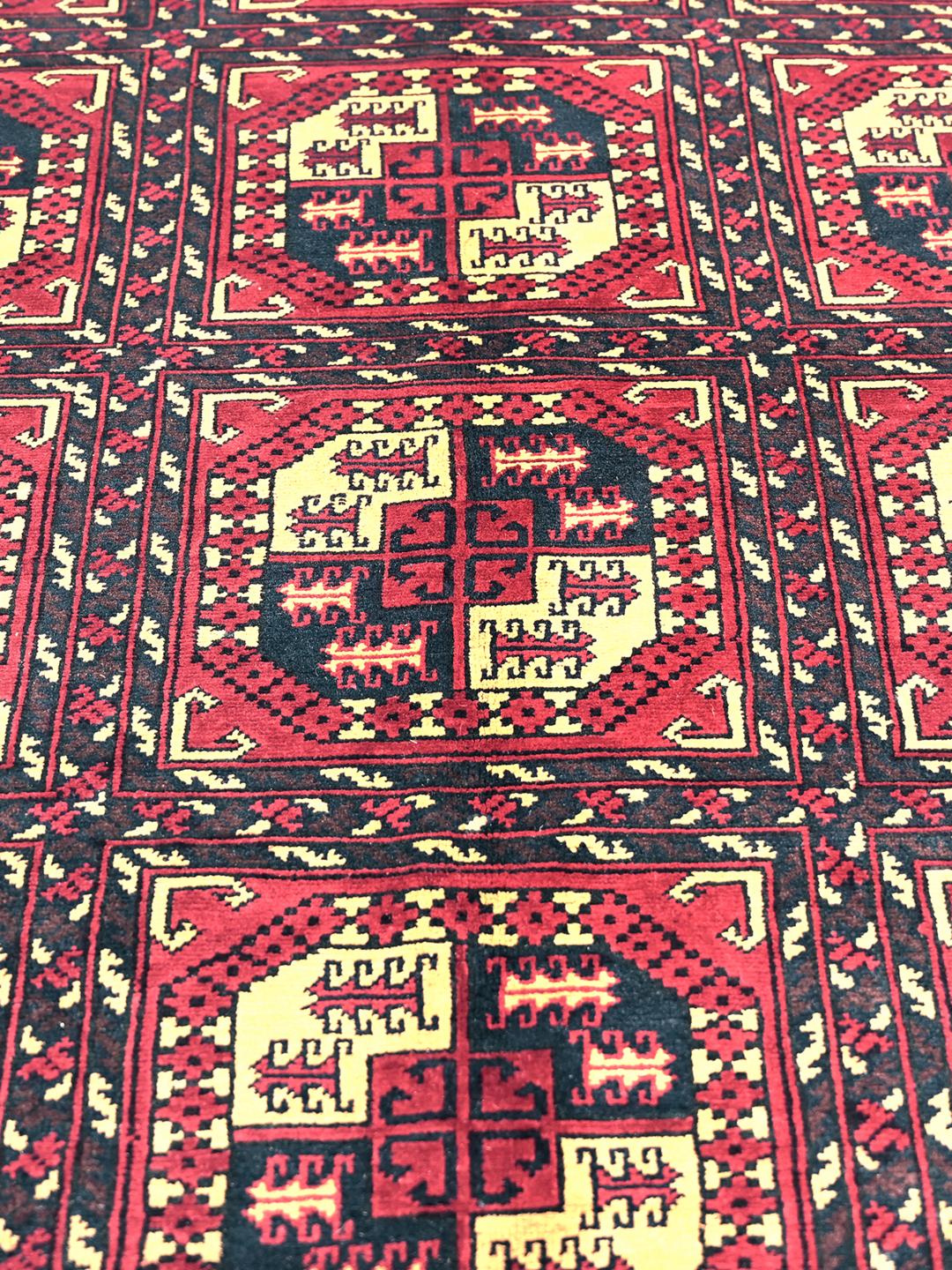Handmade Afghan Kunduz rug in red