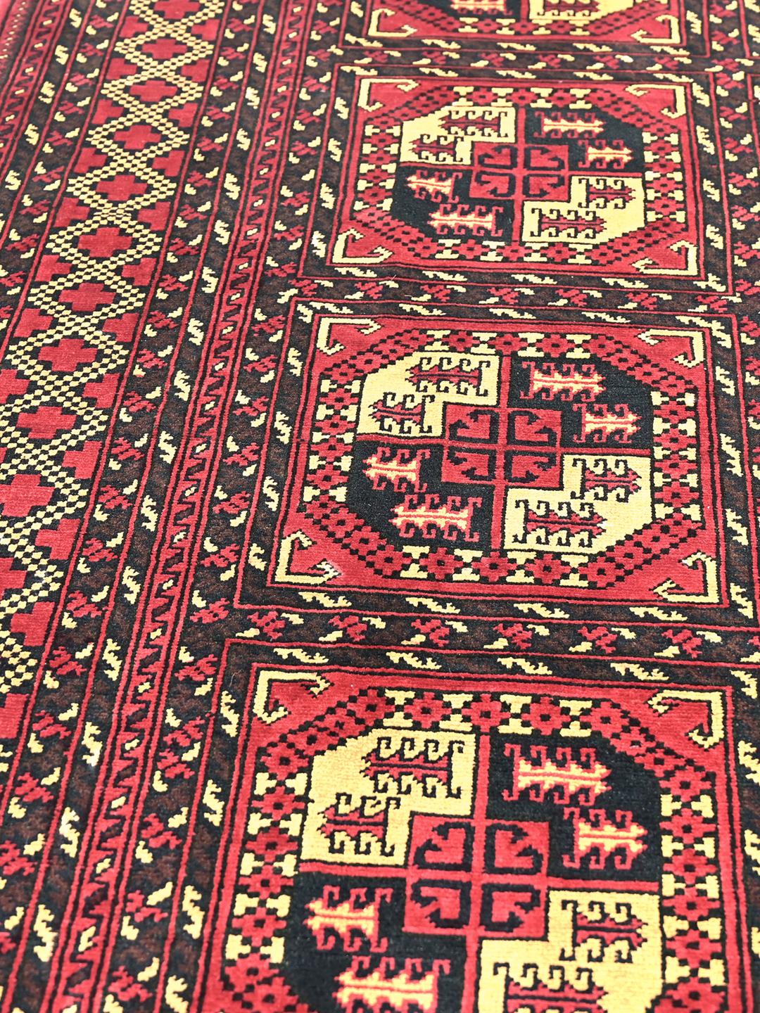 Handmade Afghan Kunduz rug in red
