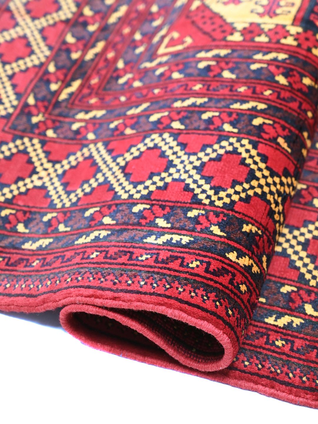 Handmade Afghan Kunduz rug in red