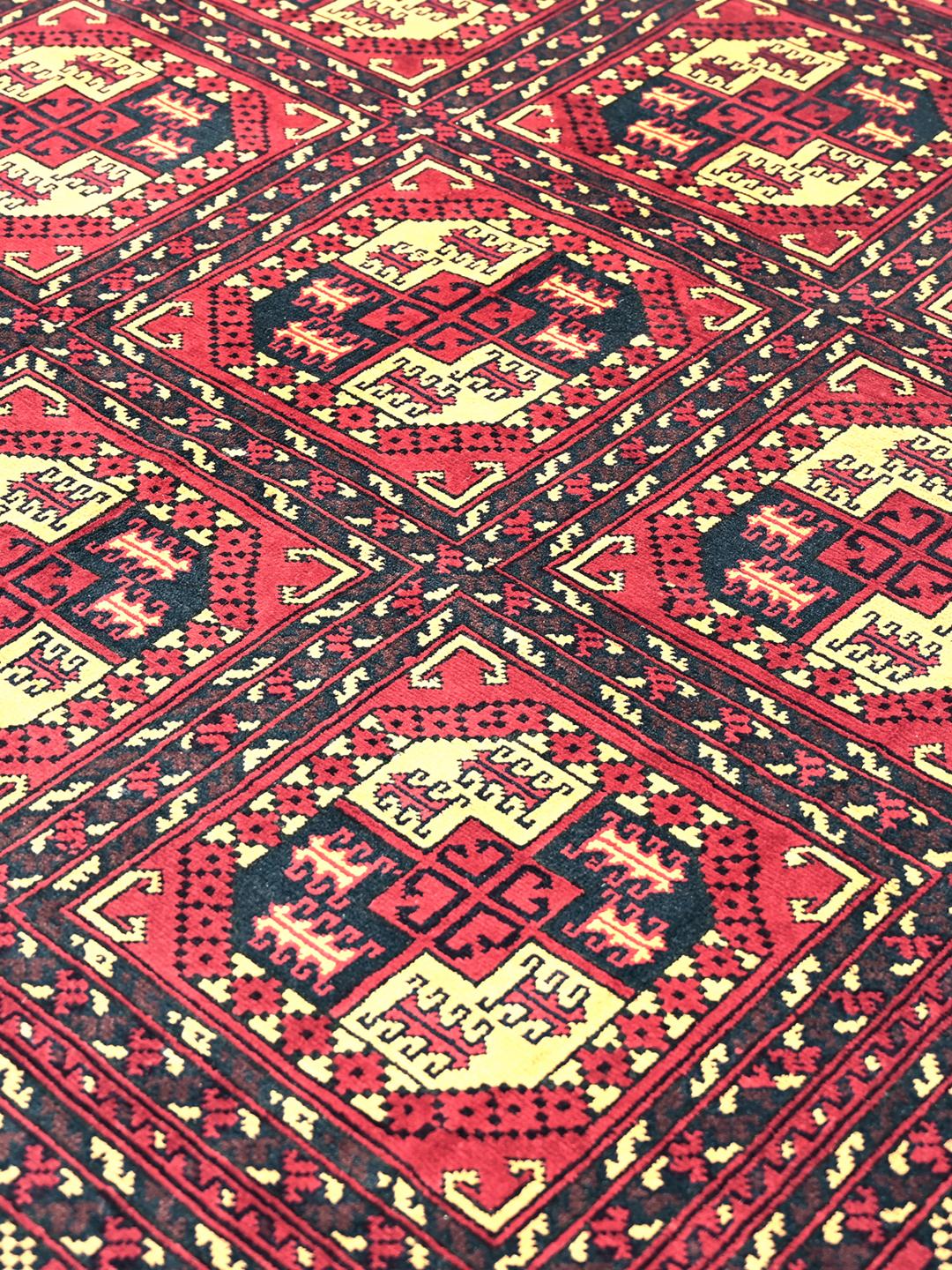 Handmade Afghan Kunduz rug in red