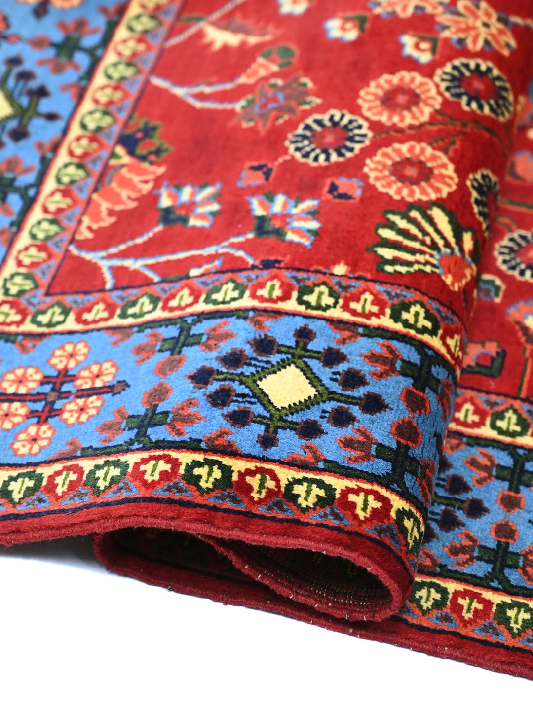 Handgeknoopt Afghaans Kunduz-tapijt met een rood veld van Wool en een blauwe rand