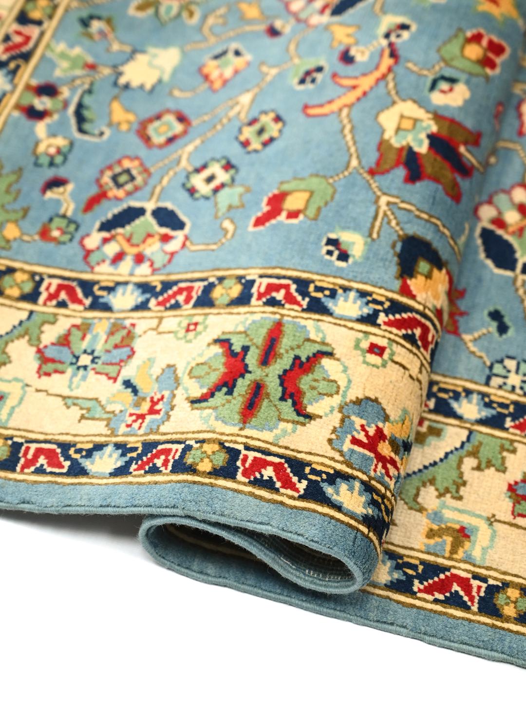 Handgeknoopt Afghaans Kunduz-tapijt in blauw met bloemmotieven