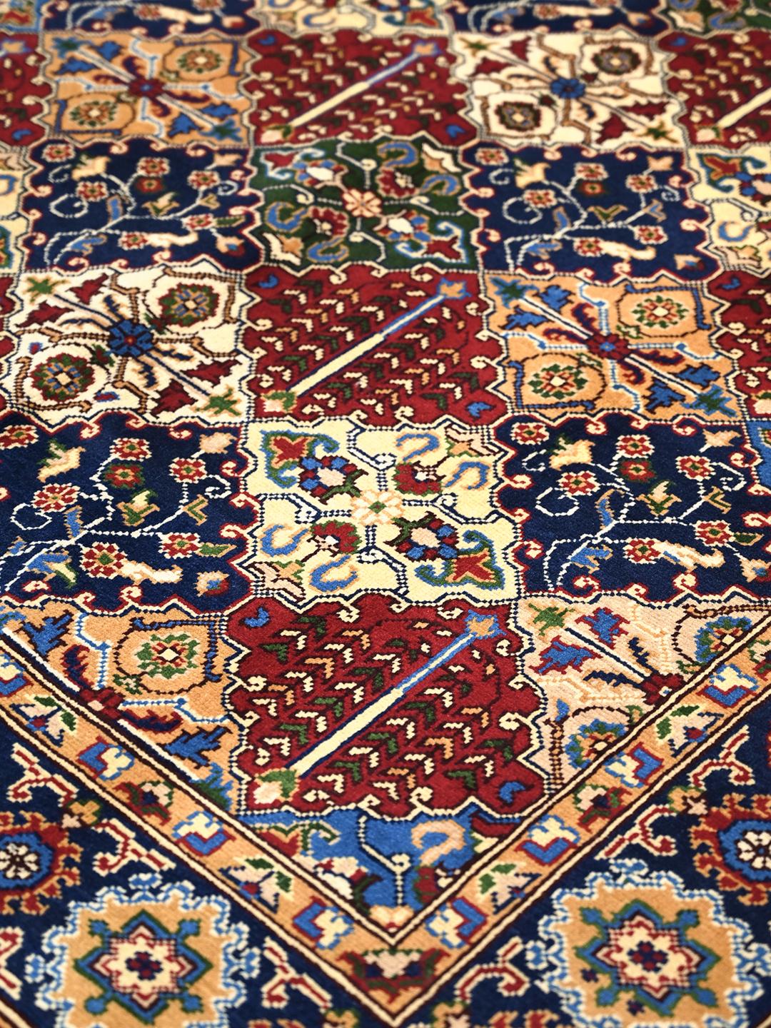 Hand-knotted Middle Eastern Kunduz rug with multicolor geometric patterns.