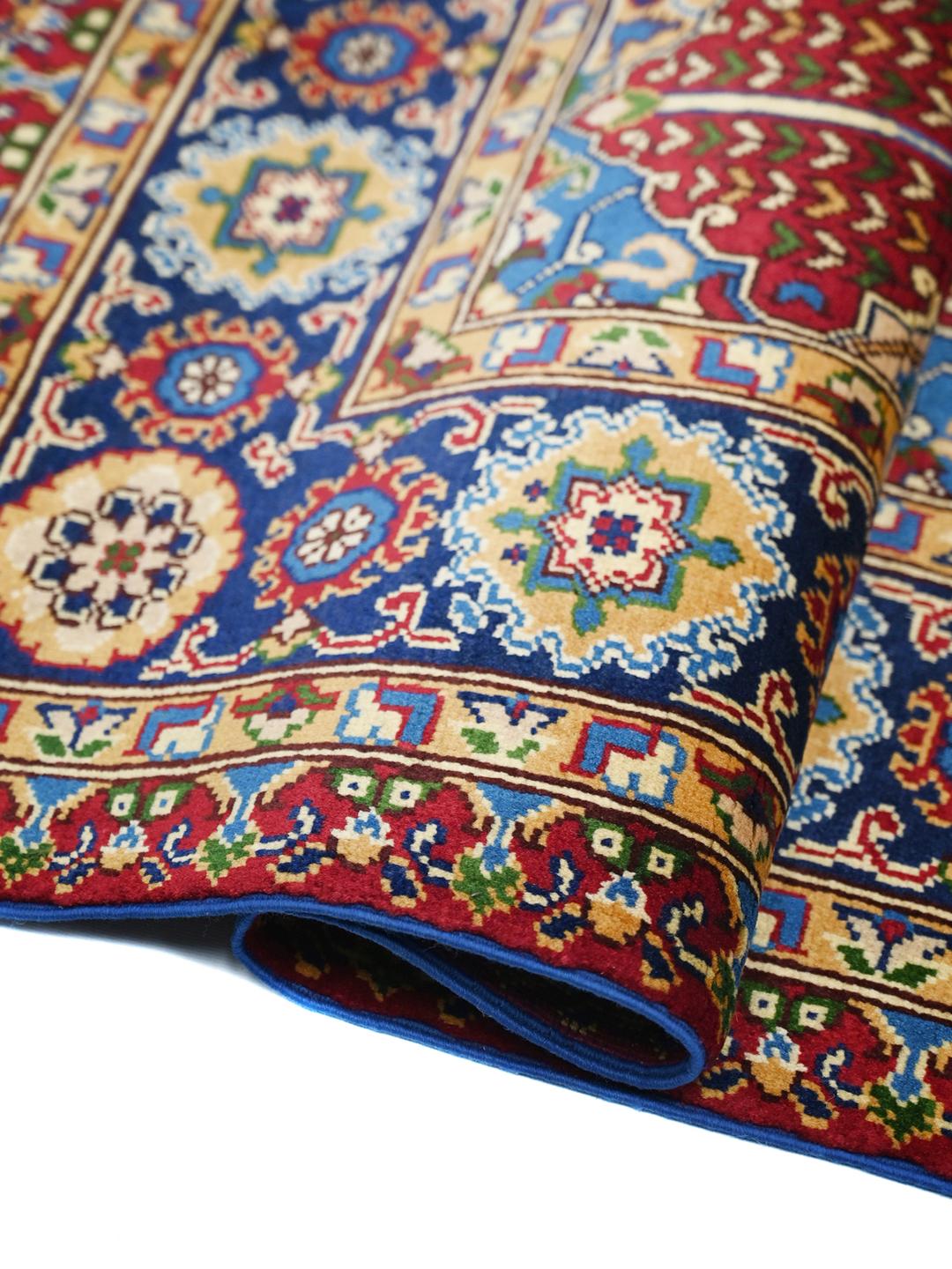 Hand-knotted Middle Eastern Kunduz rug with multicolor geometric patterns.